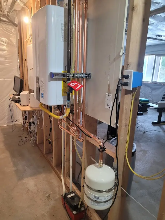 Licensed plumber repairing a kitchen sink in Kasson