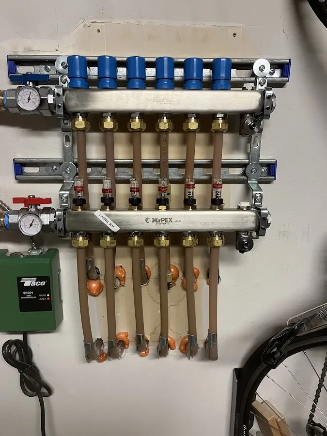 Plumber performing Water Heater Repair at a residential property in Kasson